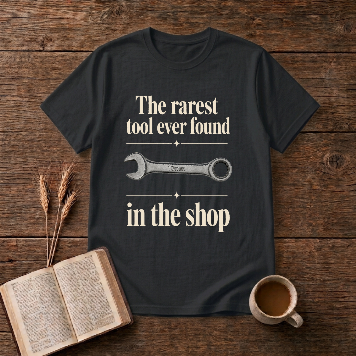 Vintage-style wrench graphic with understated text on a Black unisex T-Shirt
