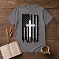 Distressed American flag with white cross on a Charcoal t-shirt