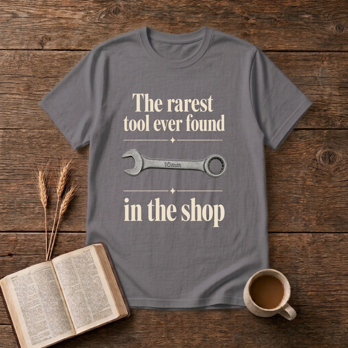 Vintage-style wrench graphic with understated text on a Charcoal unisex T-Shirt