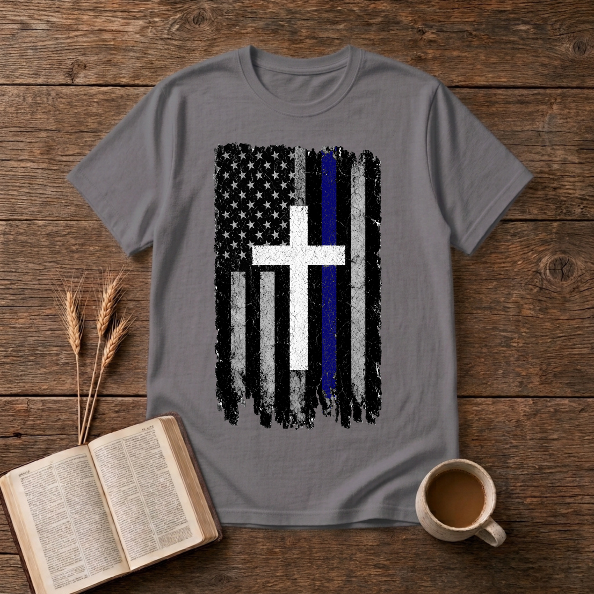 Faded black and white American flag with a thin blue line and cross on a Charcoal unisex T-Shirt