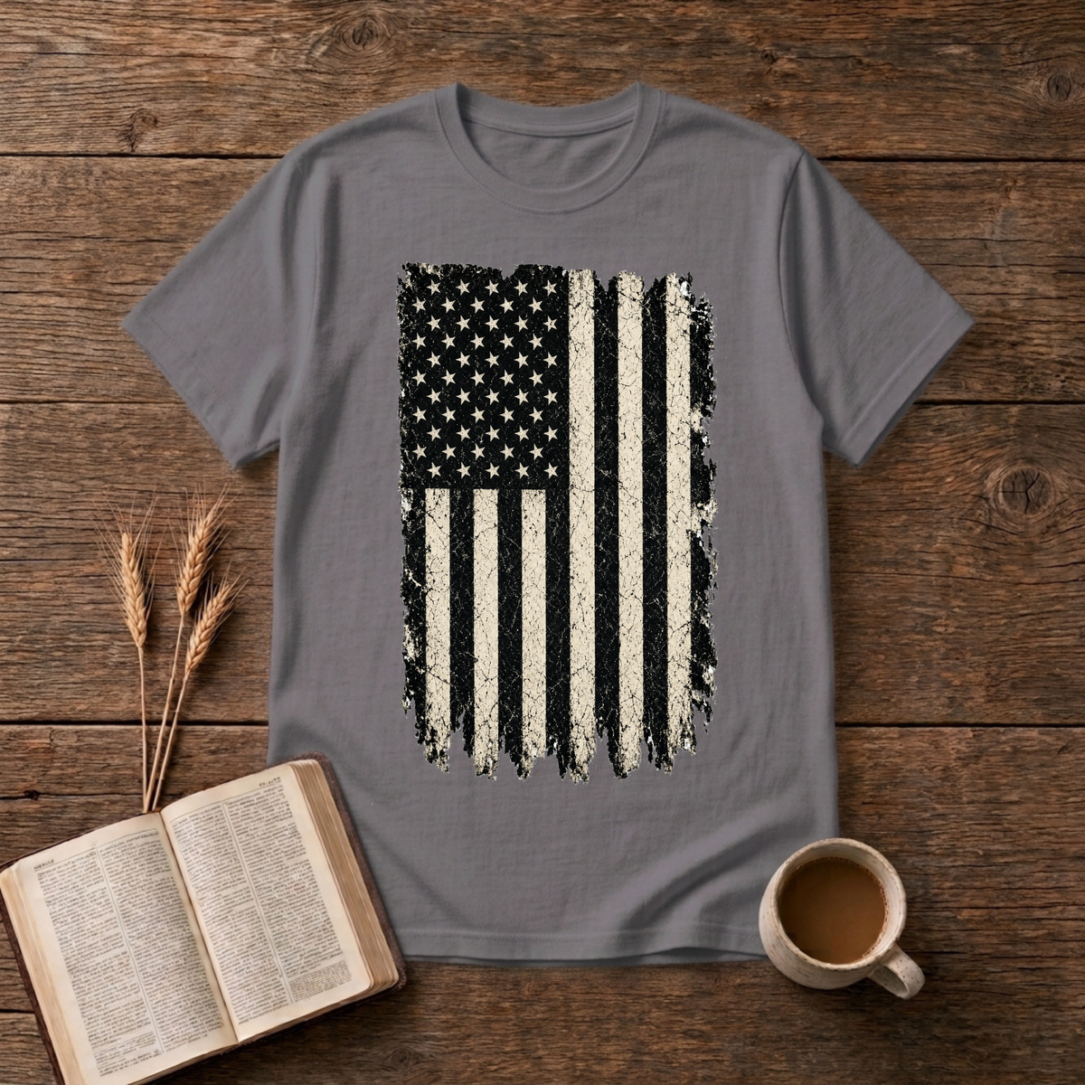Distressed grayscale American flag with faded edges on a Charcoal unisex T-Shirt