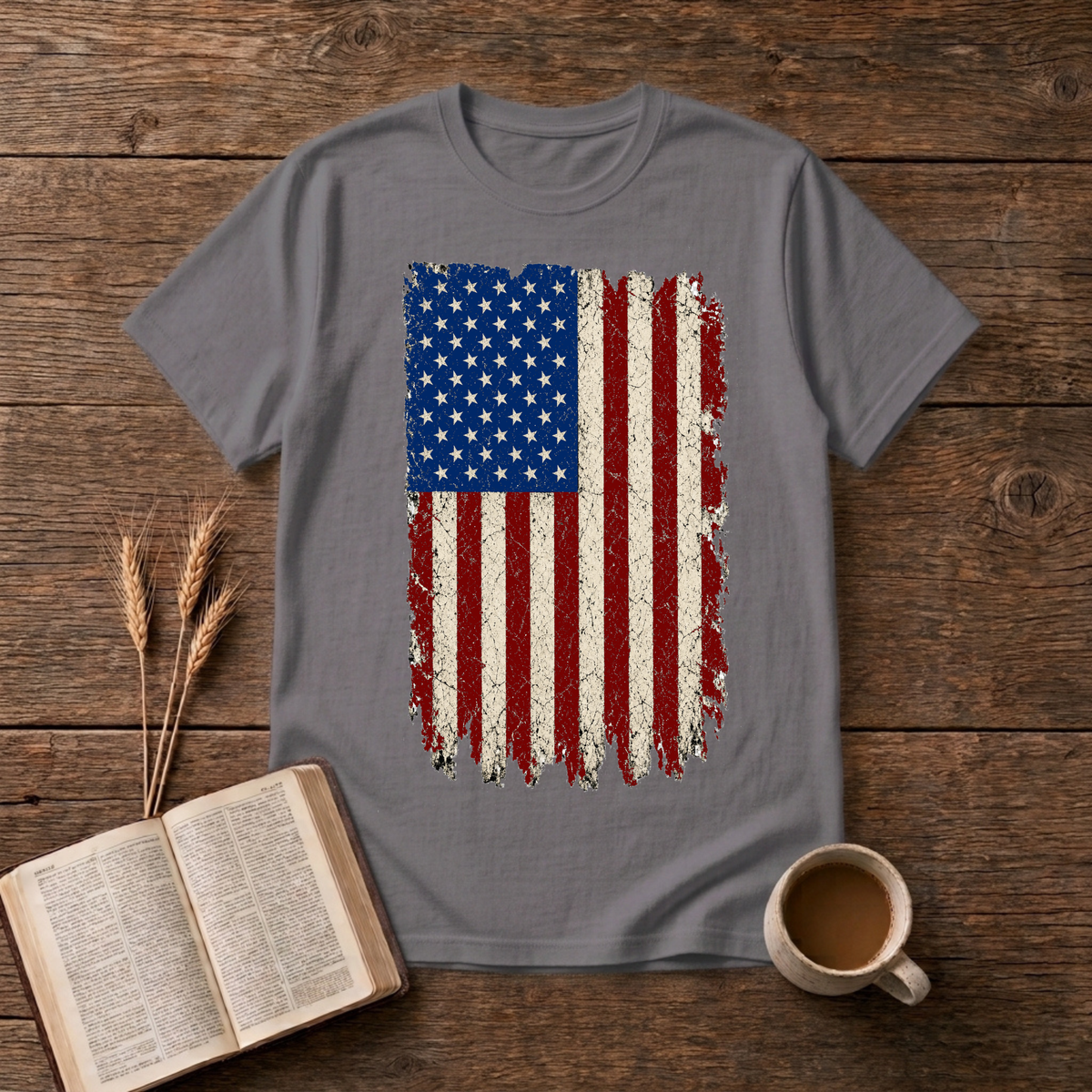 Distressed red, white and blue American flag with brushstroke edges on a Charcoal unisex T-Shirt.