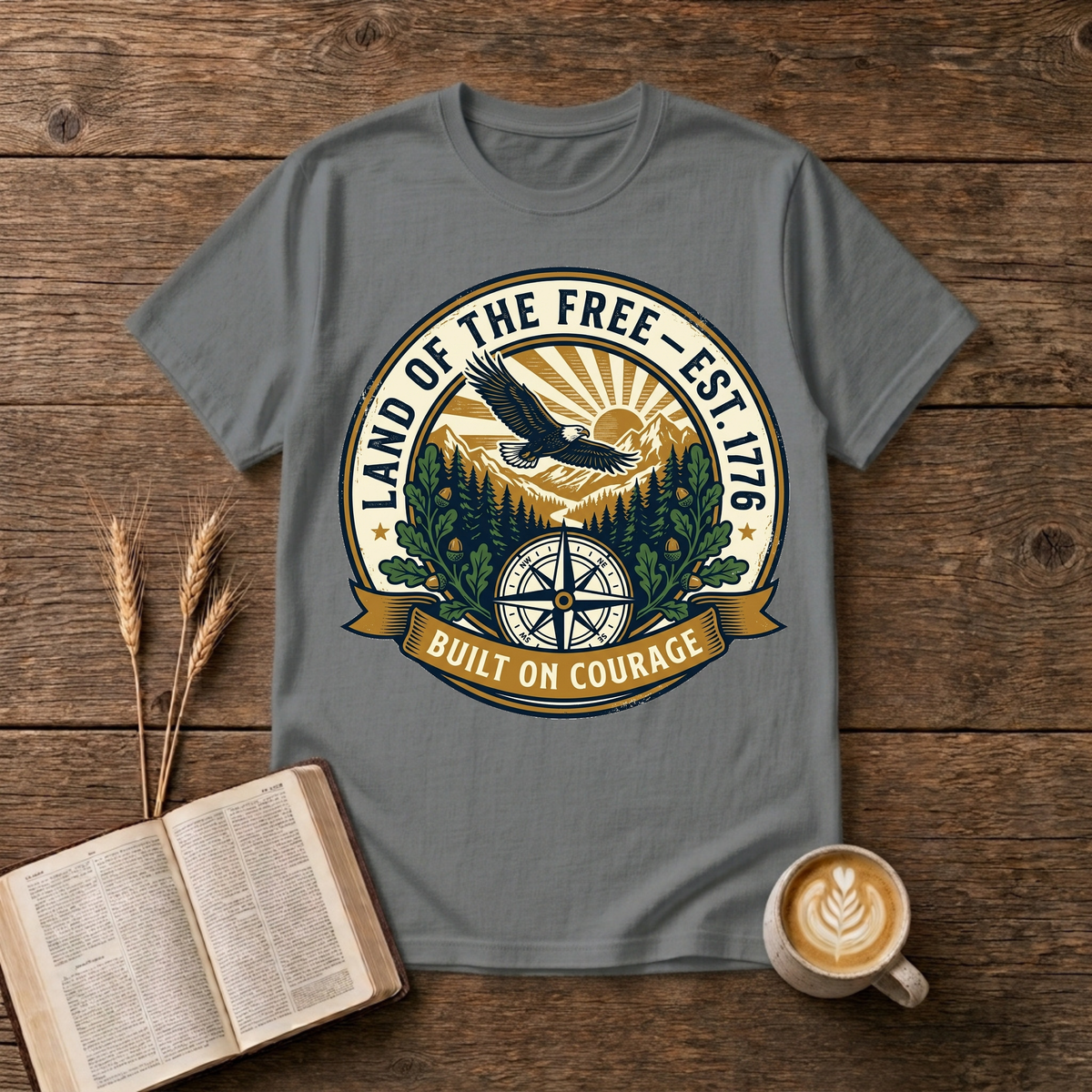 Faded emblem of an eagle gliding above pine silhouettes with a sunrise compass on a Graphite Heather unisex T-Shirt