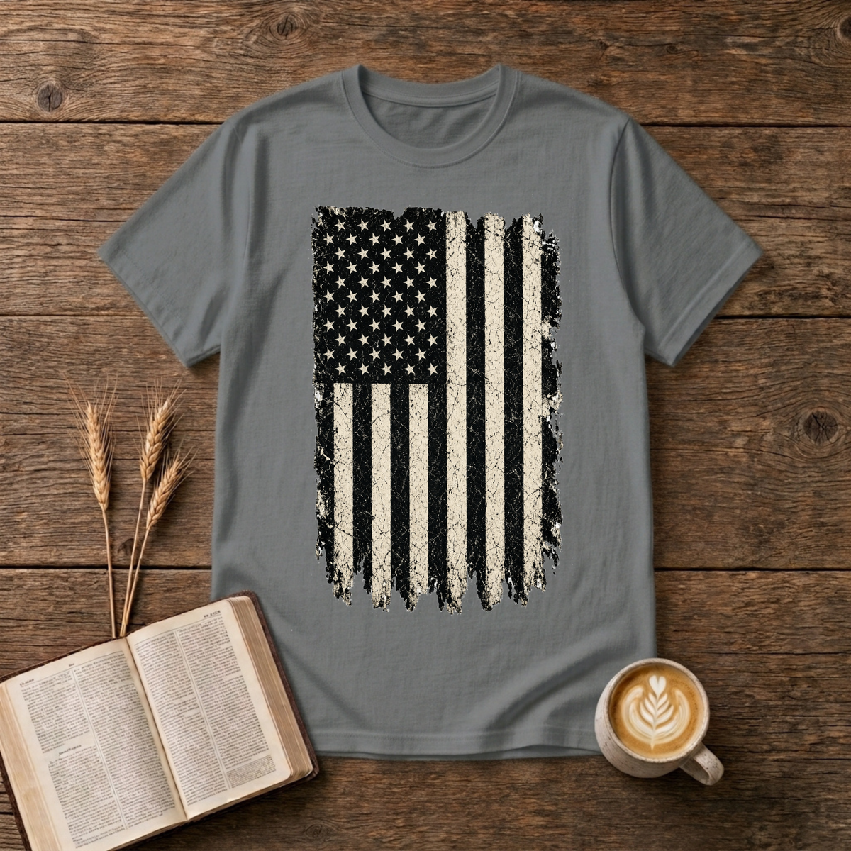 Distressed grayscale American flag with faded edges on a Graphite Heather unisex T-Shirt