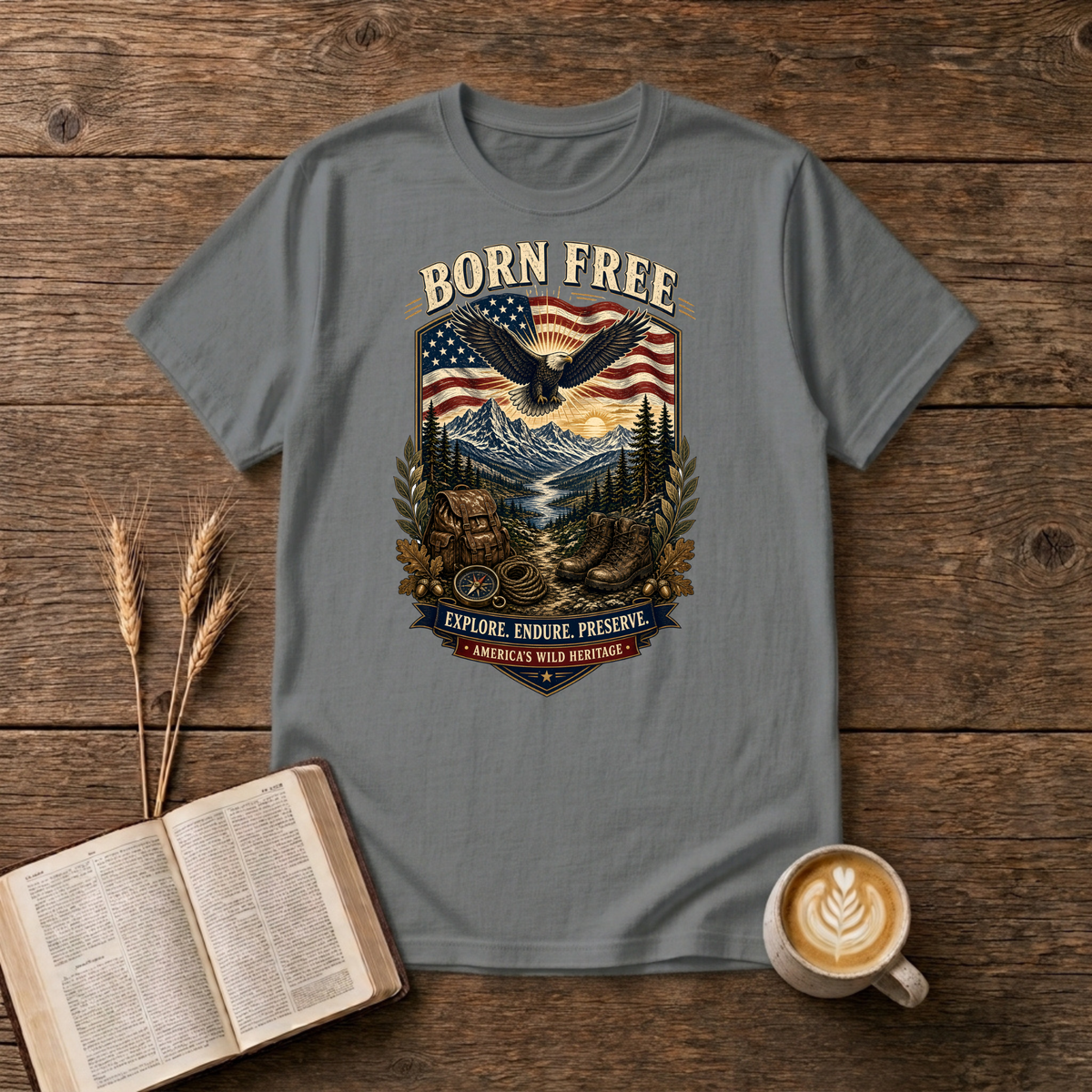 Born Free design of a soaring eagle over a waving American flag and pine-lined mountains on a Graphite Heather unisex T-Shirt