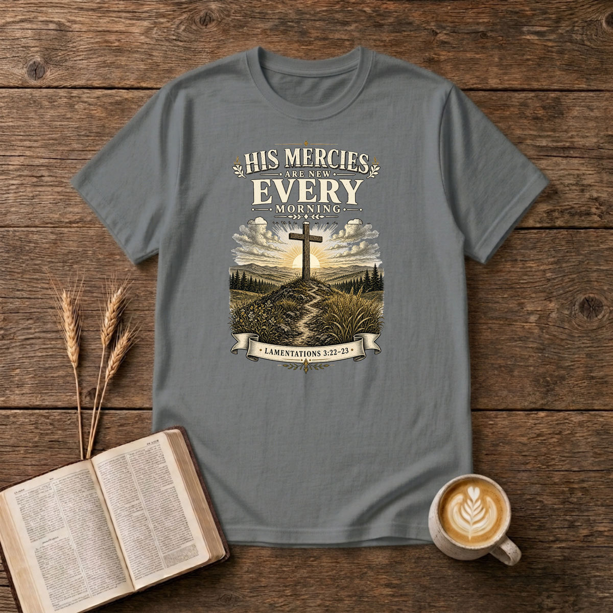 Muted sunrise behind a cross with His mercies are new every morning on a Graphite Heather unisex T-Shirt