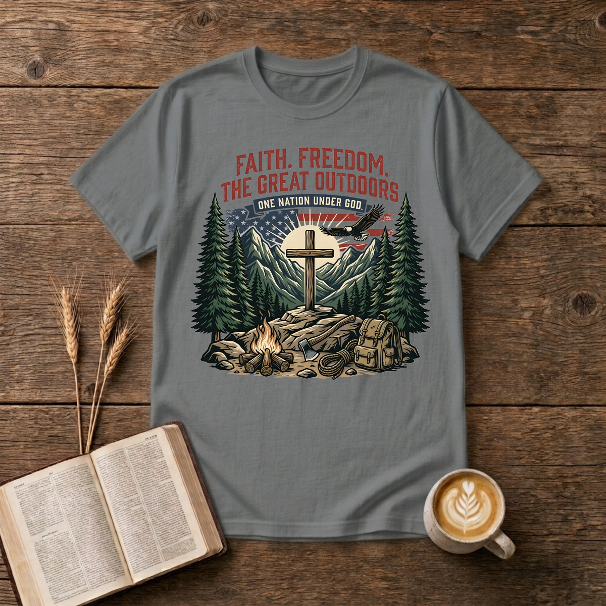 Wooden cross over a mountain at sunrise with pines, bald eagle and American flag on a Graphite Heather unisex T-Shirt