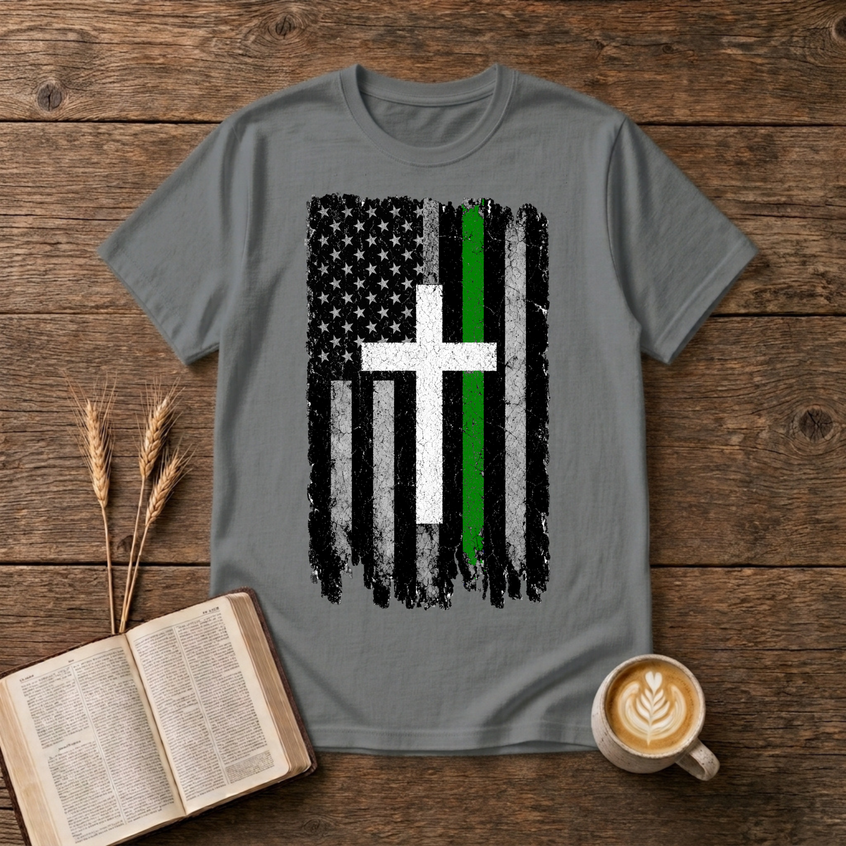 Distressed American flag fused with a cross and green line on a Graphite Heather unisex T-Shirt