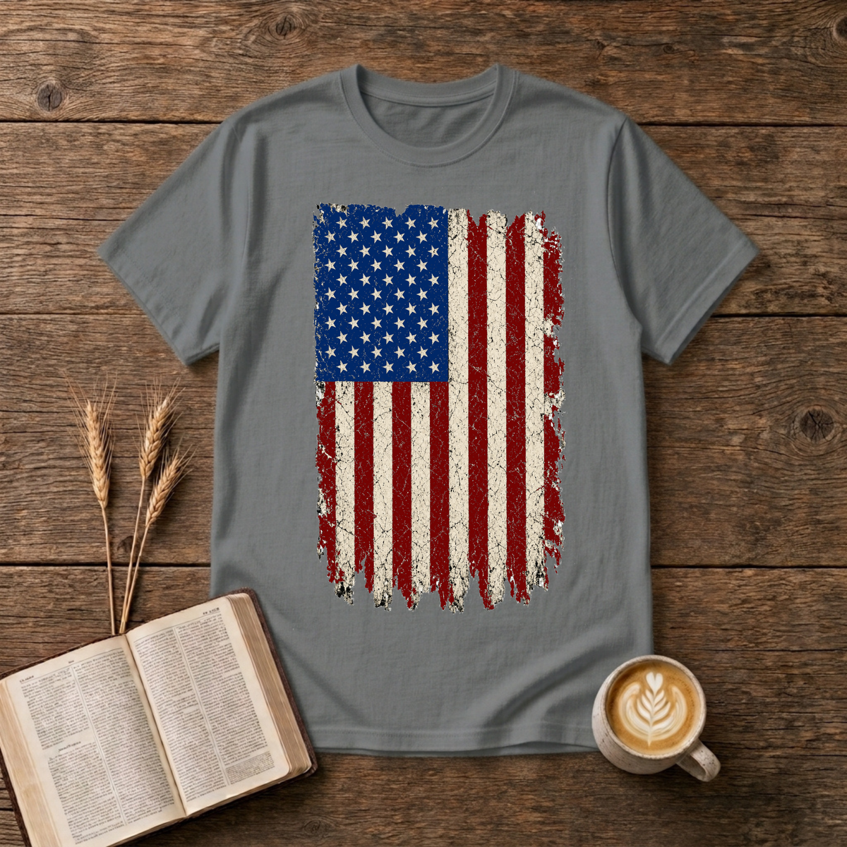Distressed red, white and blue American flag with brushstroke edges on a Graphite Heather unisex T-Shirt.
