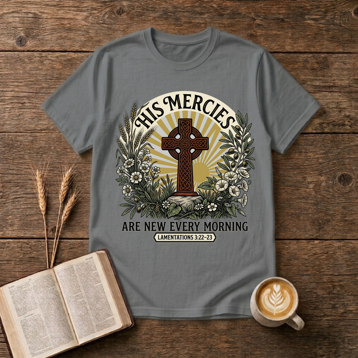 Celtic-style cross framed by florals and warm rays with His mercies are new every morning on a Graphite Heather T-Shirt