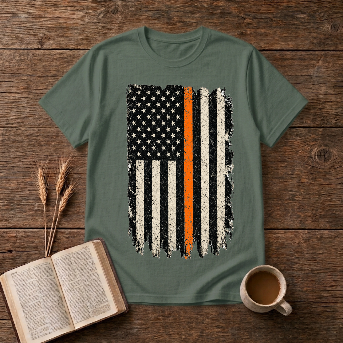 Distressed monochrome American flag with a thin orange line on a Military Green unisex T-Shirt