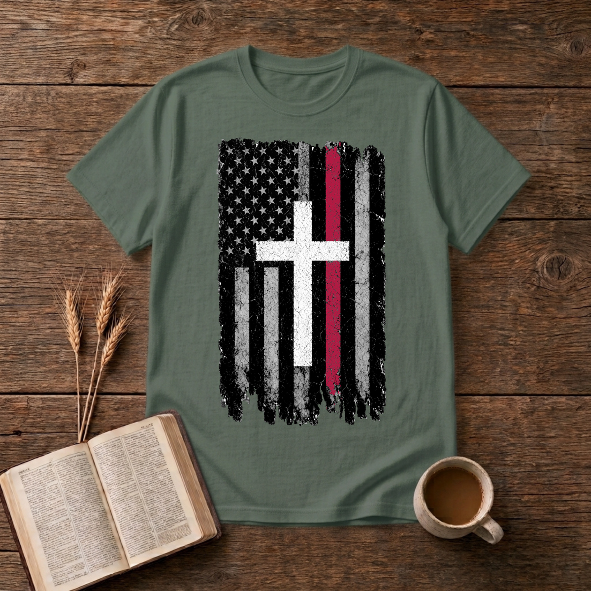 Grayscale American flag with a thin red stripe and cross motif on a Military Green unisex T-Shirt