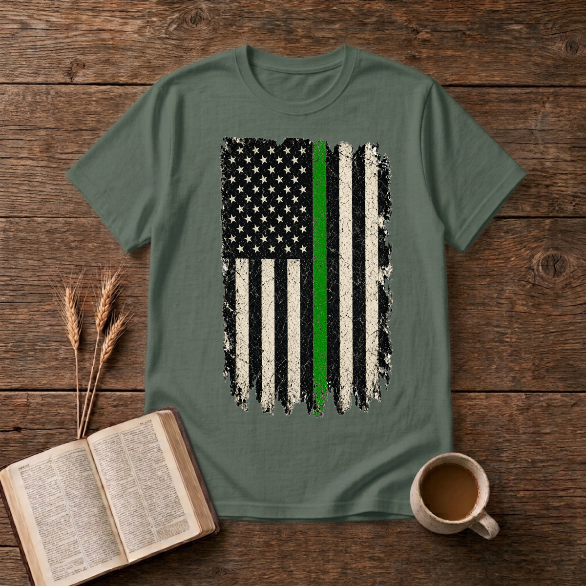 Distressed monochrome American flag with a thin green line on a Military Green unisex T-Shirt