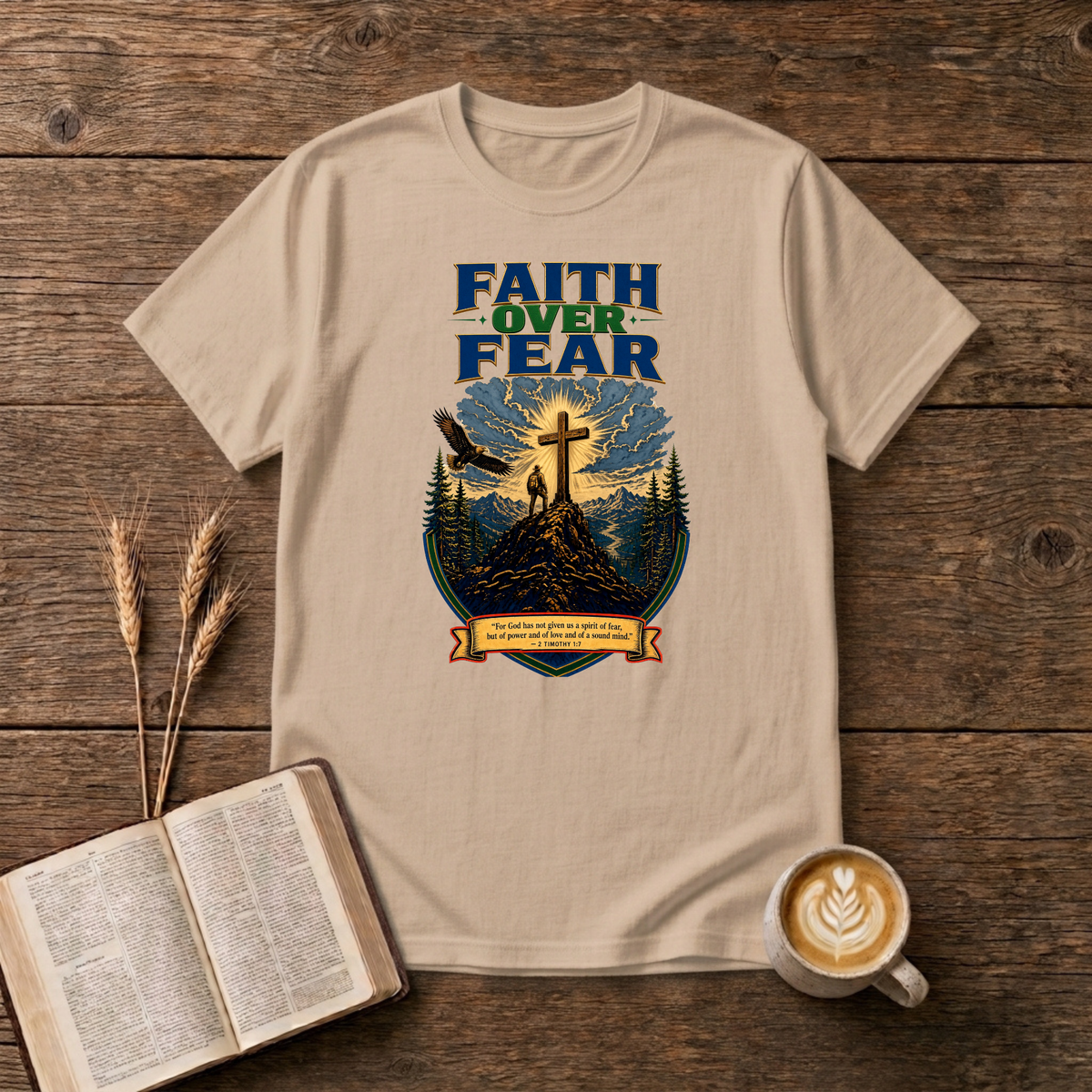 Faith Over Fear lettering over a mountain silhouette, pines and glowing cross on a Natural unisex T-Shirt