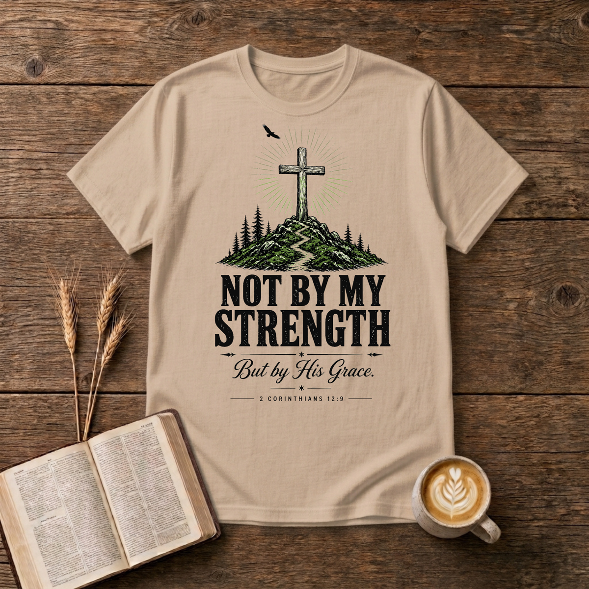 Hand-drawn cross on a rugged hill surrounded by pines with a lone bird on a Natural unisex T-Shirt