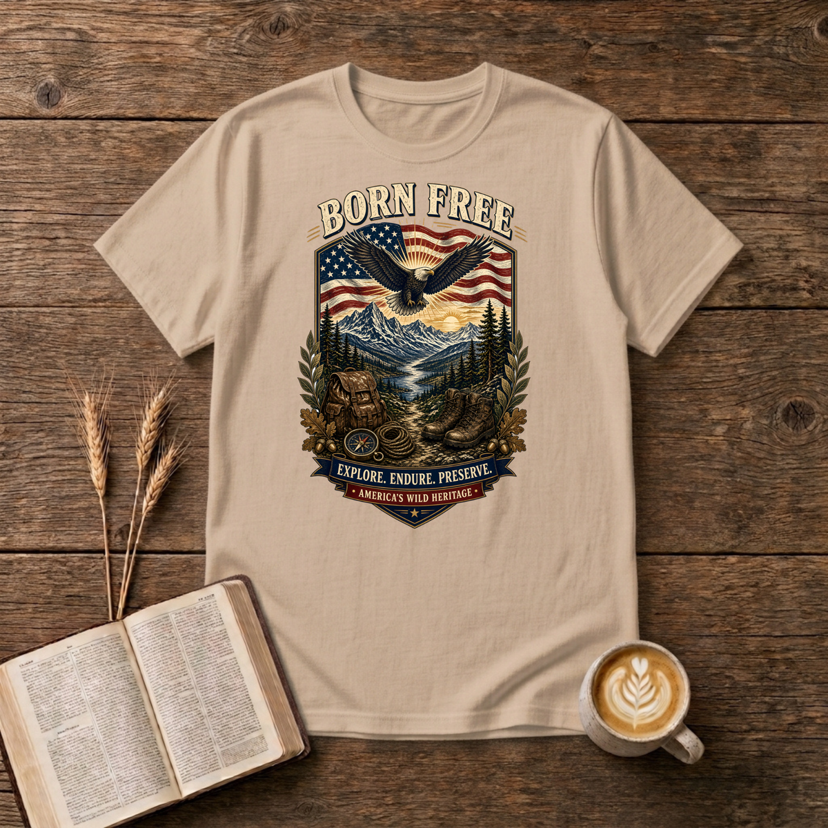 Born Free design of a soaring eagle over a waving American flag and pine-lined mountains on a Natural unisex T-Shirt