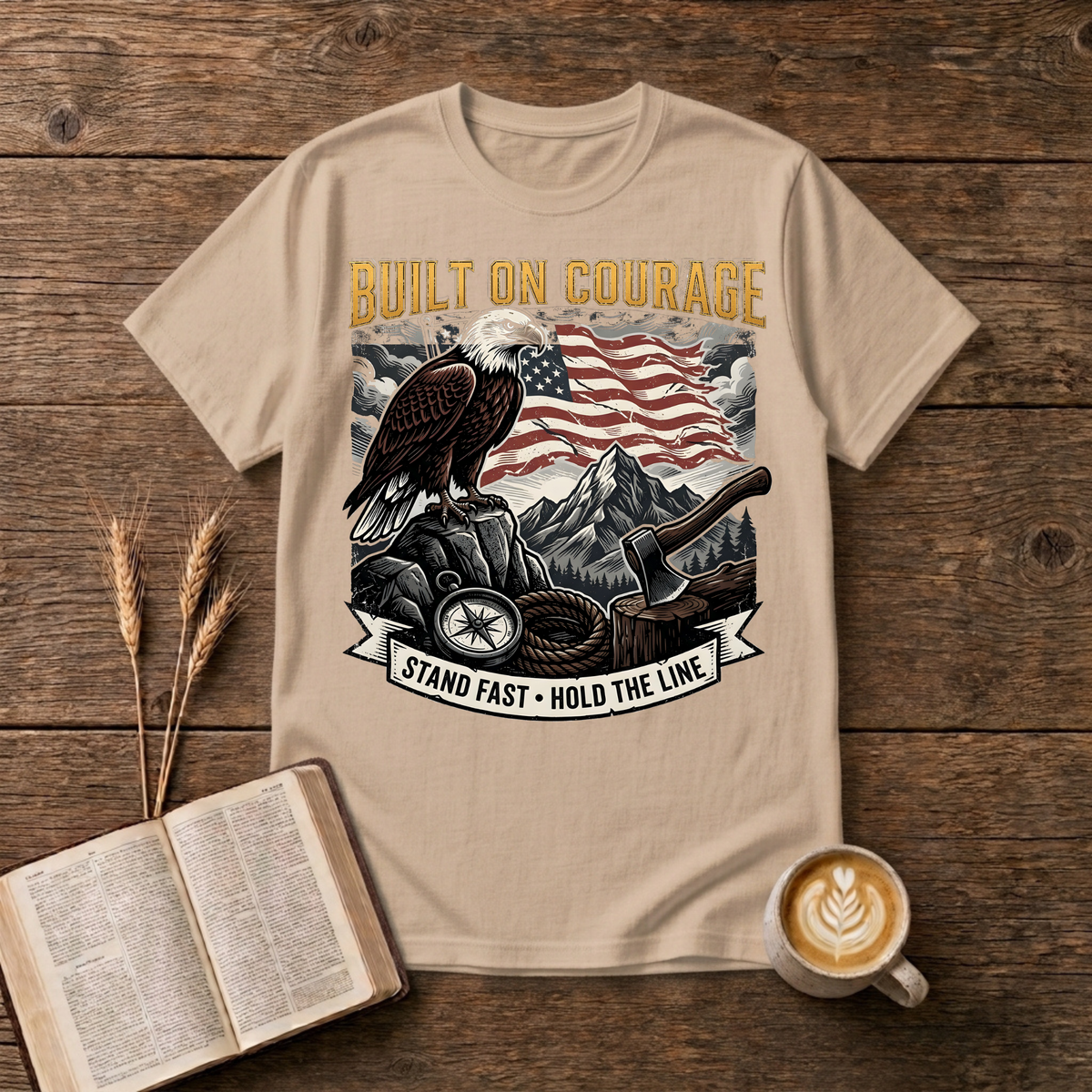 Built on Courage design of a stoic eagle before mountains with a faded American flag on a Natural unisex T-Shirt