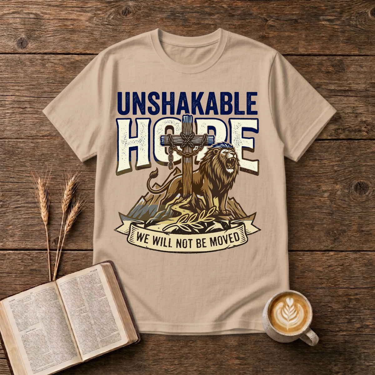 UNSHAKABLE HOPE lettering above a cross and lion illustration on a Natural unisex T-Shirt