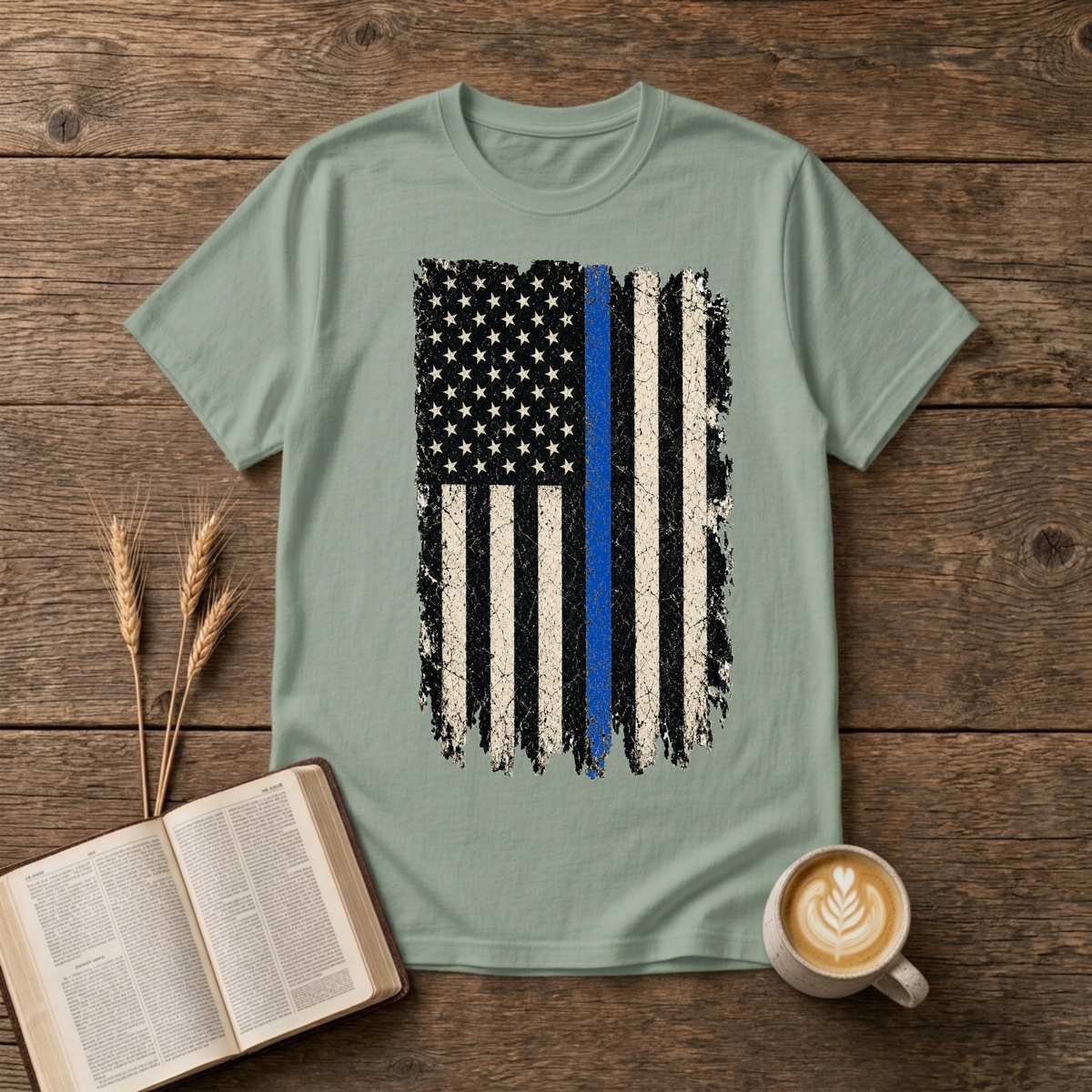 Distressed black and white American flag with a thin blue line on a Sage unisex T-Shirt