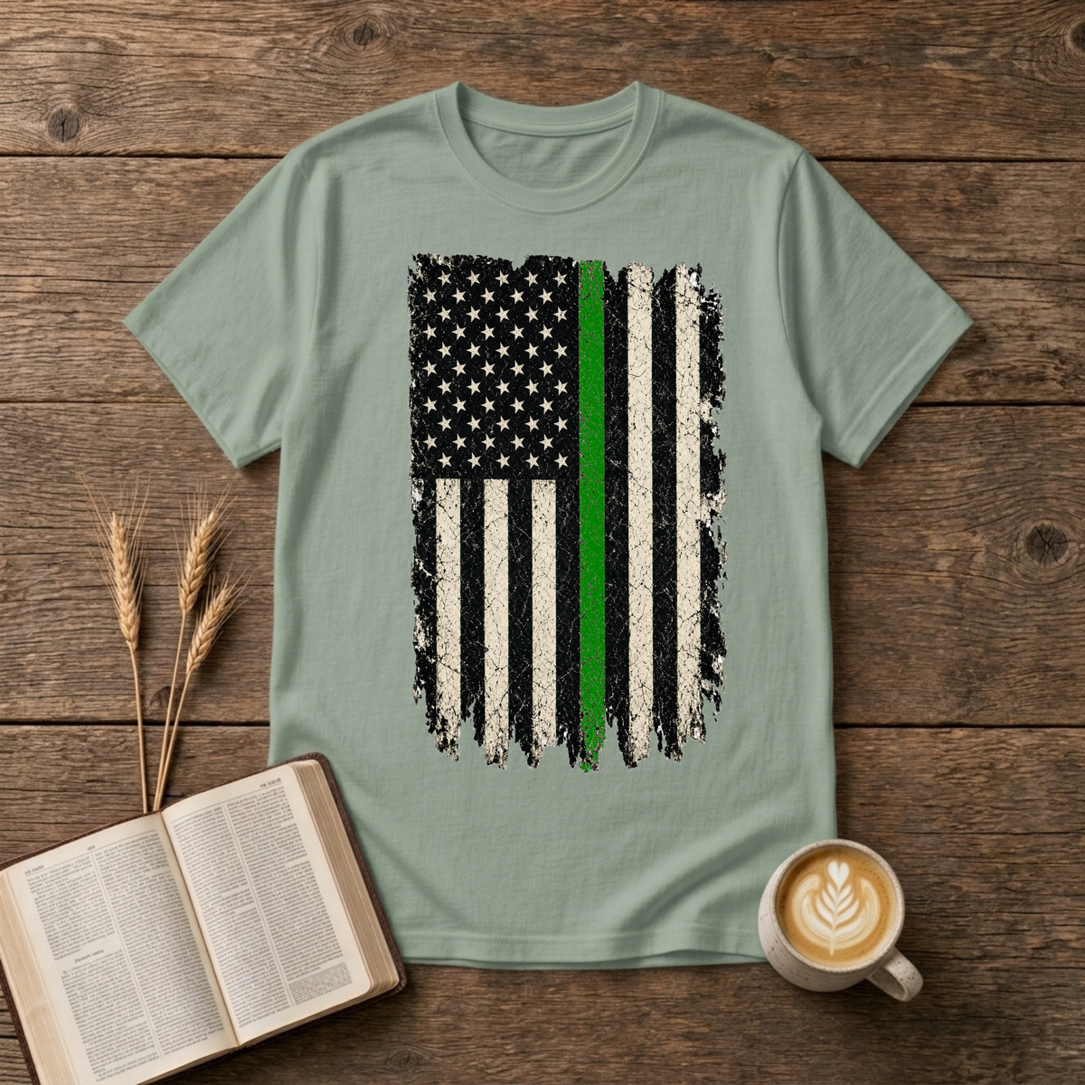 Distressed monochrome American flag with a thin green line on a Sage unisex T-Shirt