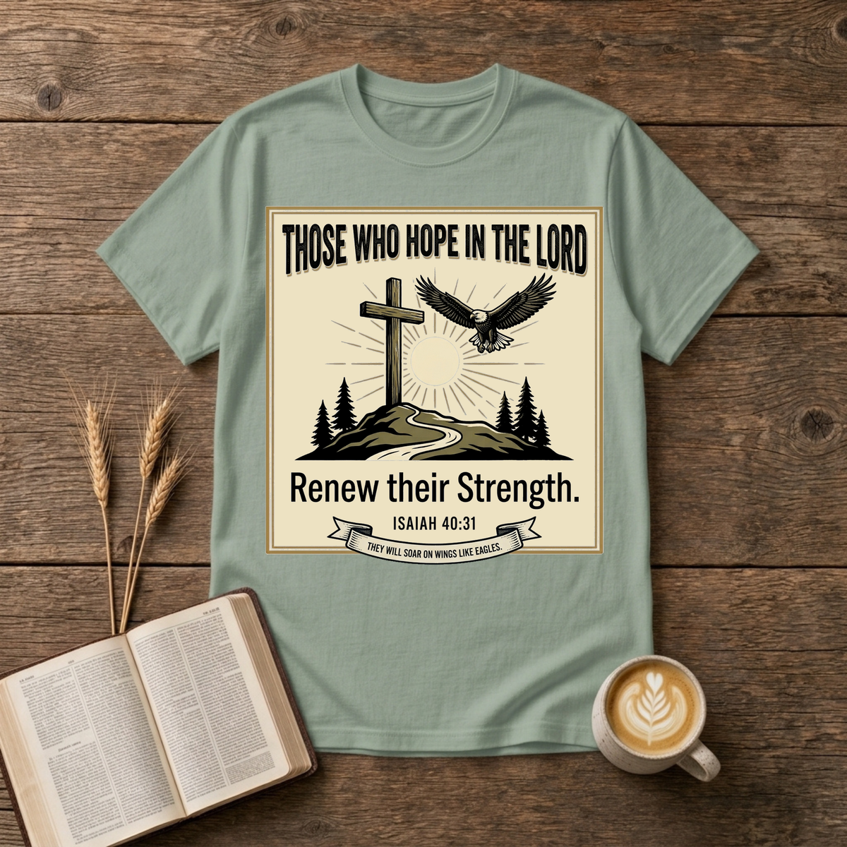 Hand-etched cross on a hill beneath a rising sun with an eagle overhead in a wreath frame on a Sage unisex T-Shirt