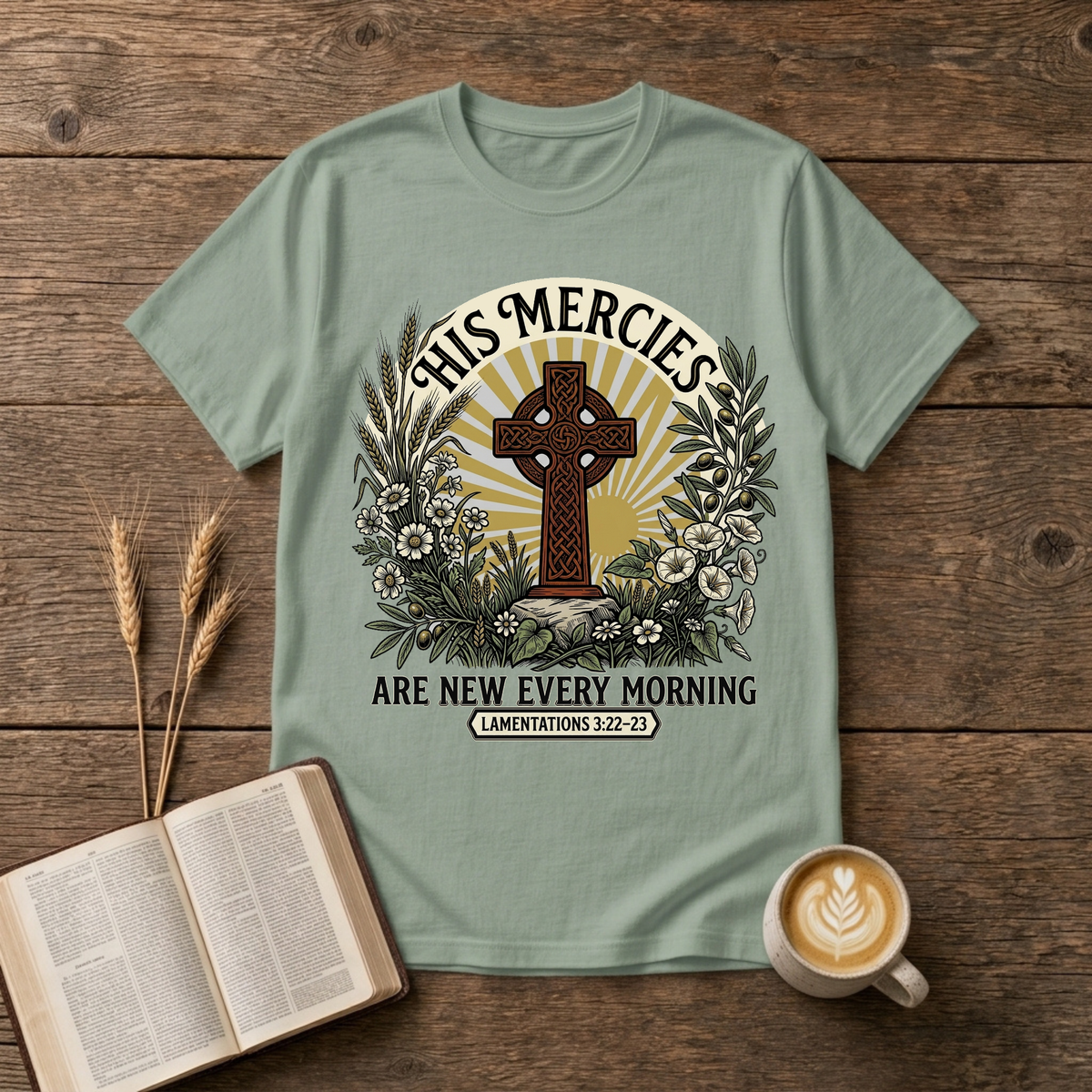 Celtic-style cross framed by florals and warm rays with His mercies are new every morning on a Sage unisex T-Shirt