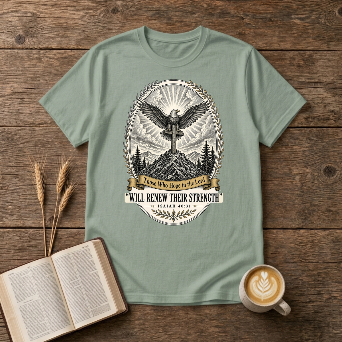 Grayscale eagle emblem with outstretched wings above a mountain landscape on a Sage unisex T-Shirt