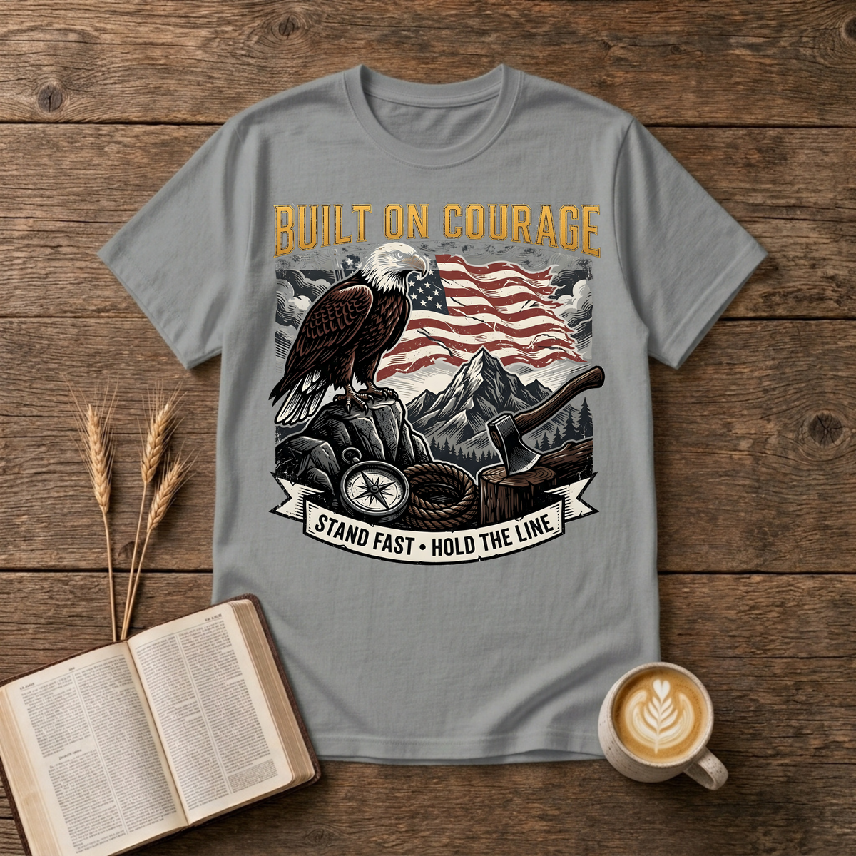 Built on Courage design of a stoic eagle before mountains with a faded American flag on a Sport Grey unisex T-Shirt