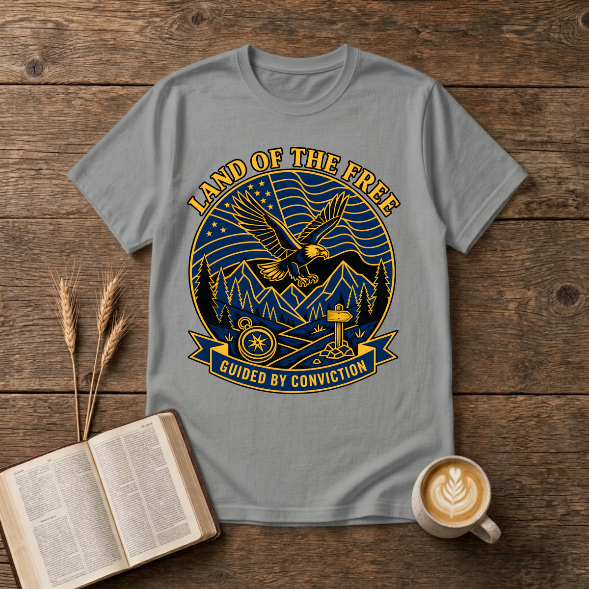 Bold monochrome emblem of an eagle in flight above mountains on a Sport Grey unisex T-Shirt