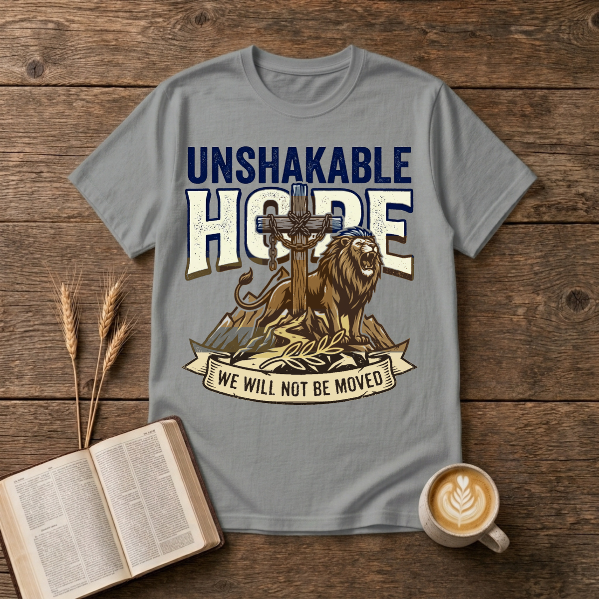 UNSHAKABLE HOPE lettering above a cross and lion illustration on a Sport Grey unisex T-Shirt