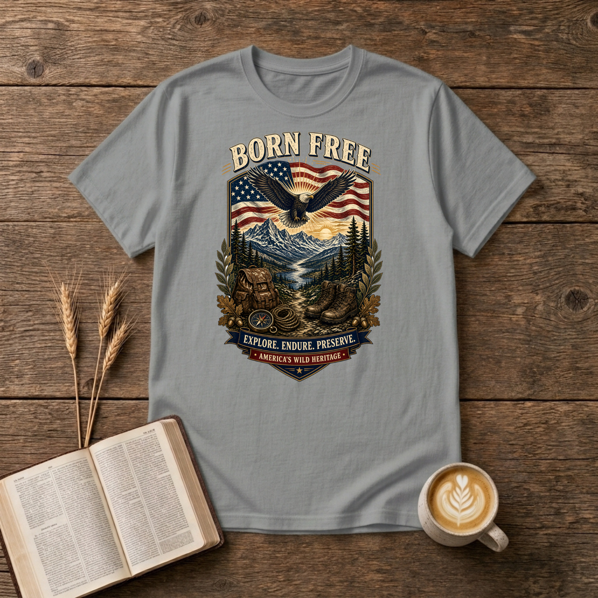 Born Free design of a soaring eagle over a waving American flag and pine-lined mountains on a Sport Grey unisex T-Shirt