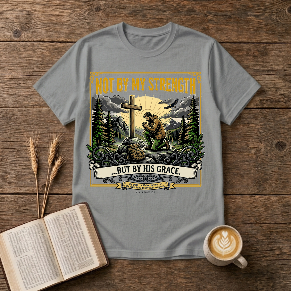 Figure kneeling at a cross in a forest clearing with Not By My Strength on a Sport Grey unisex T-Shirt