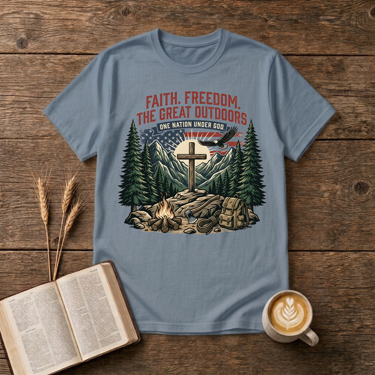 Wooden cross over a mountain at sunrise with pines, bald eagle and American flag on a Stone Blue unisex T-Shirt