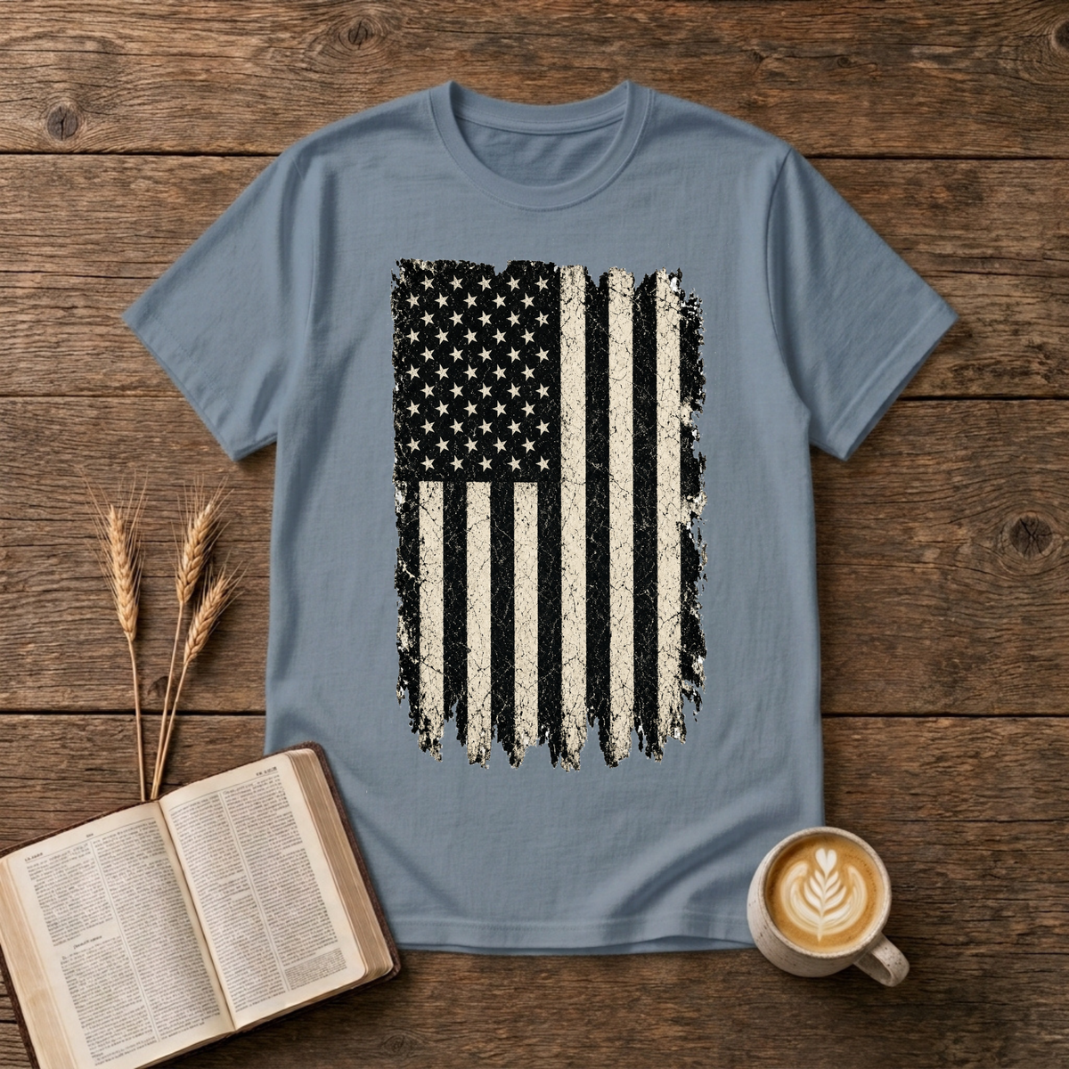 Distressed grayscale American flag with faded edges on a Stone Blue unisex T-Shirt