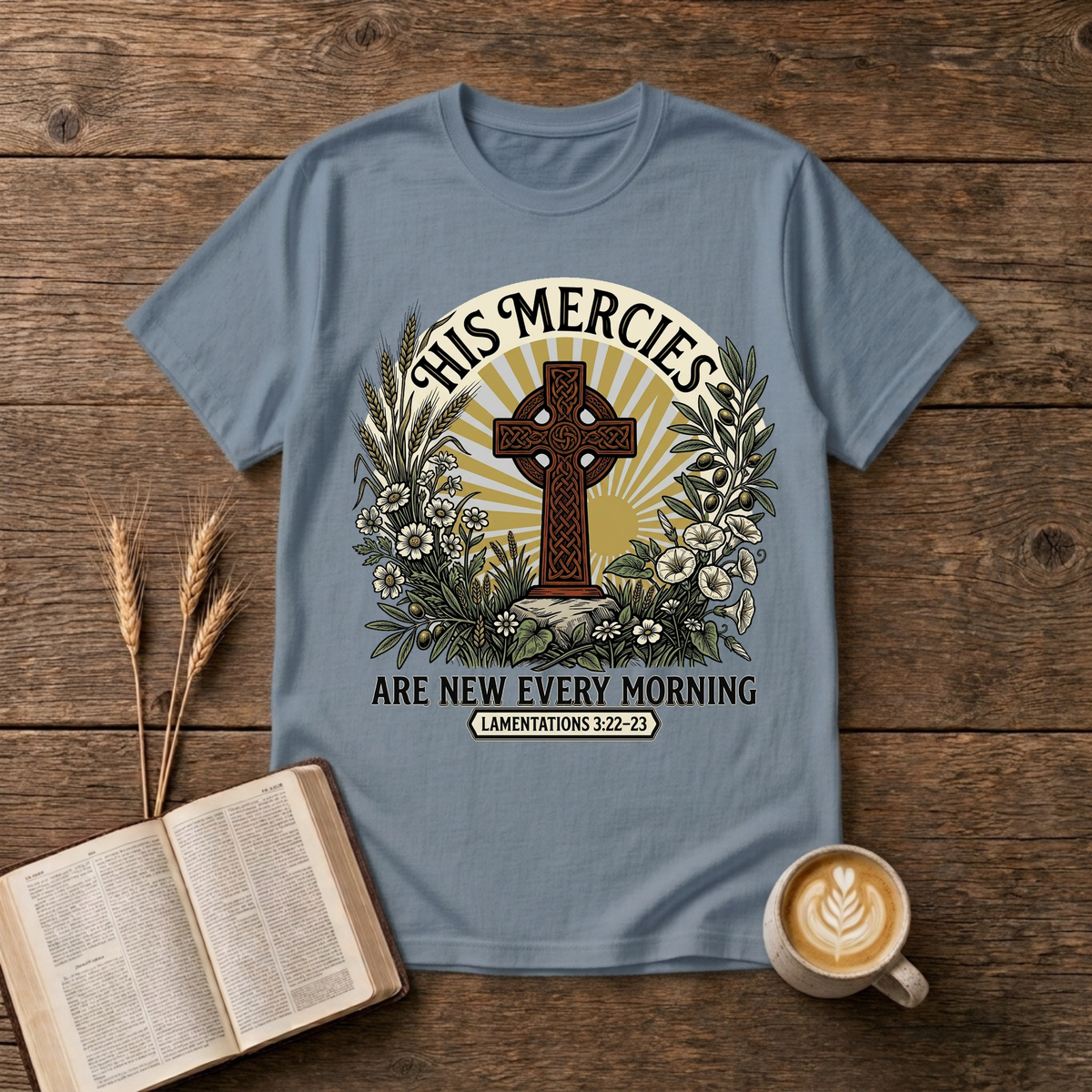 Celtic-style cross framed by florals and warm rays with His mercies are new every morning on a Stone Blue unisex T-Shirt