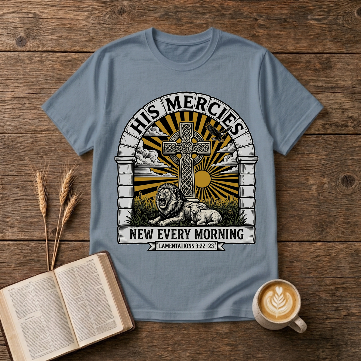 Celtic cross framed by an arched stone motif and sunrise rays on a Stone Blue unisex T-Shirt