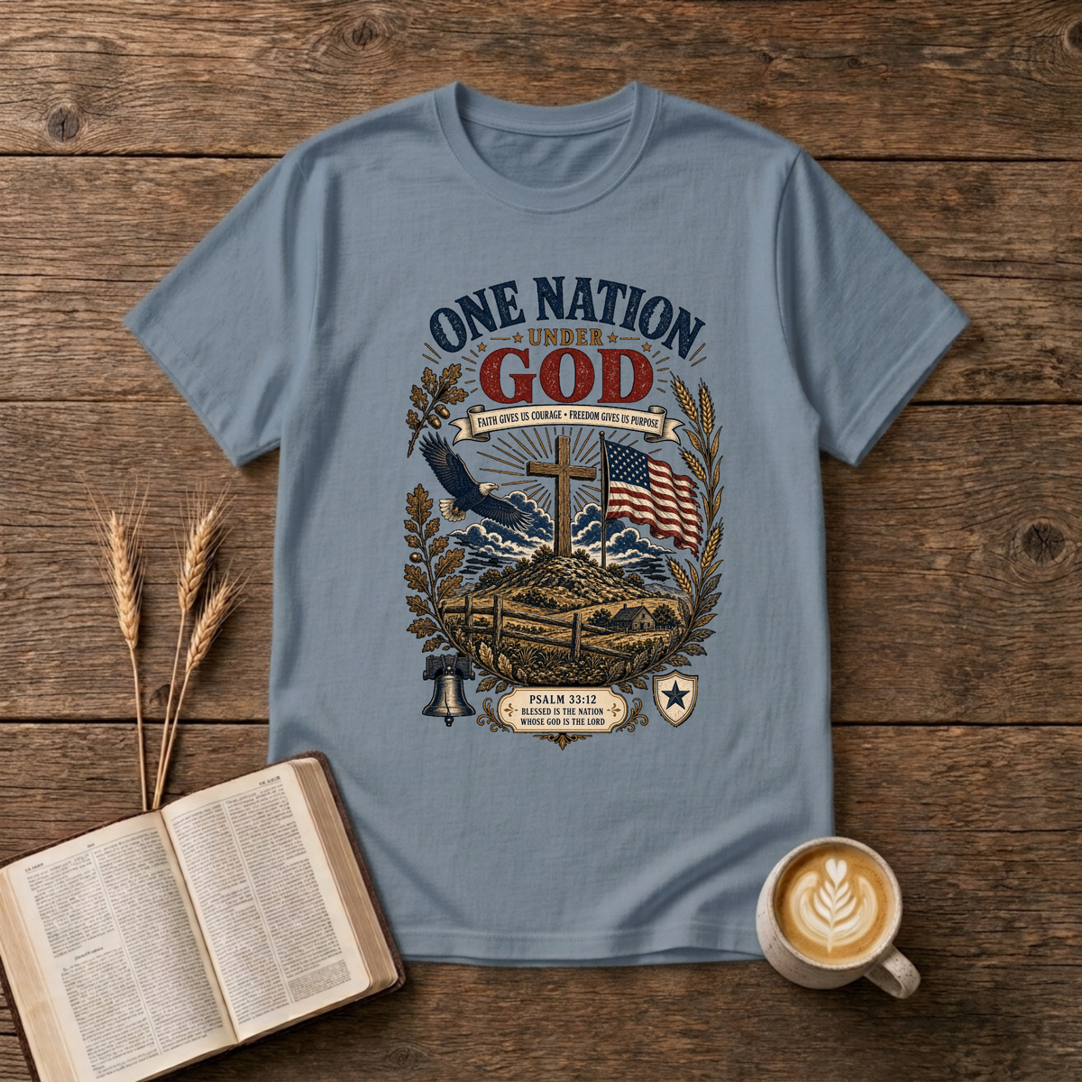 One Nation Under God design with a cross, waving flag, eagle and laurel sprigs on a Stone Blue unisex T-Shirt