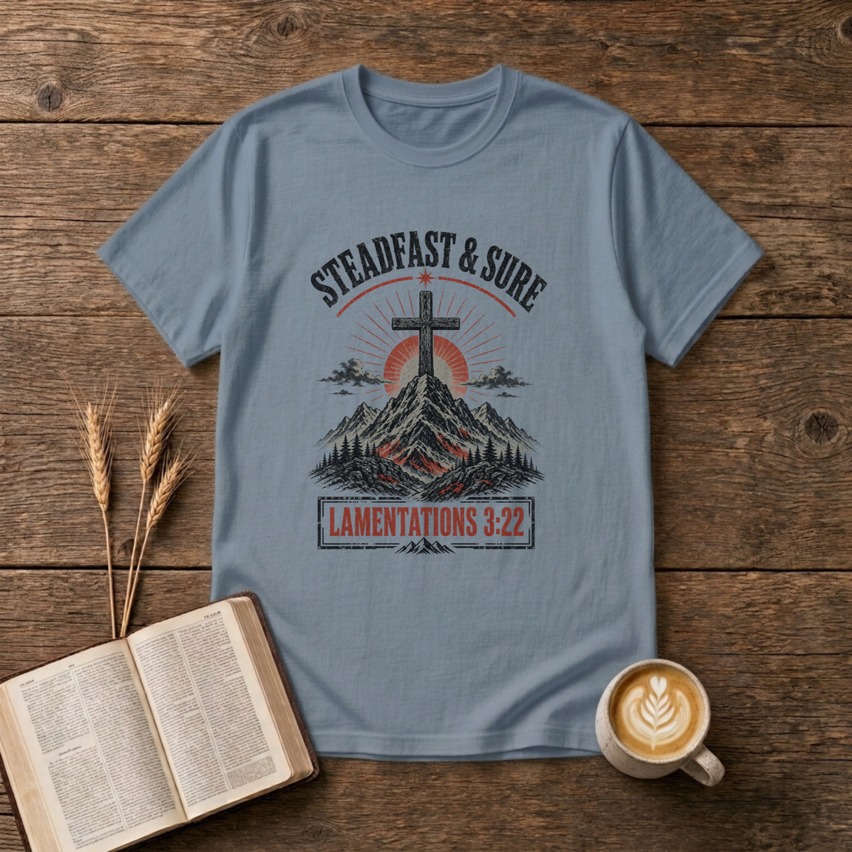 Faded cross with sunrise over mountains, Steadfast and Sure on a Stone Blue unisex T-Shirt