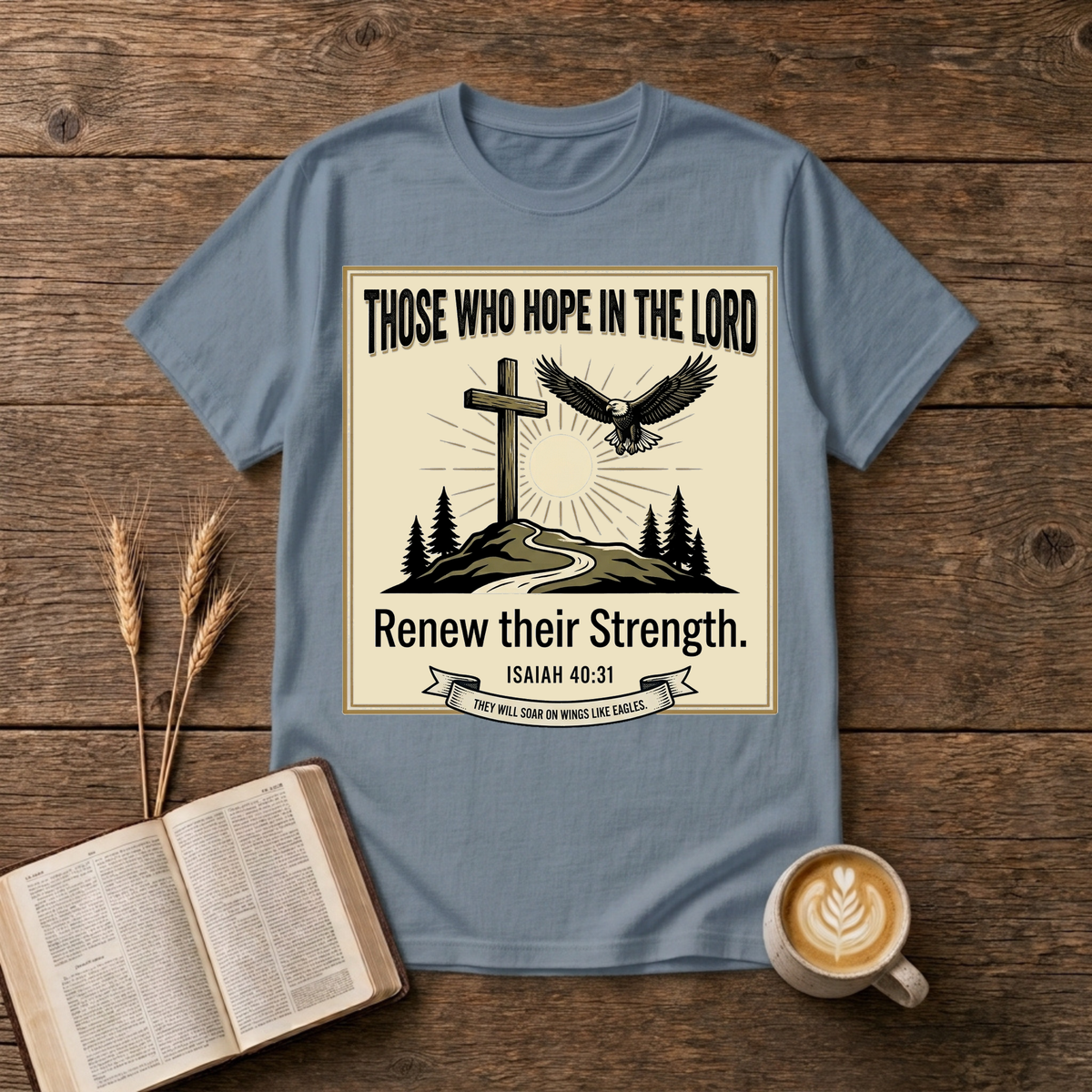 Hand-etched cross on a hill beneath a rising sun with an eagle overhead in a wreath frame on a Stone Blue unisex T-Shirt