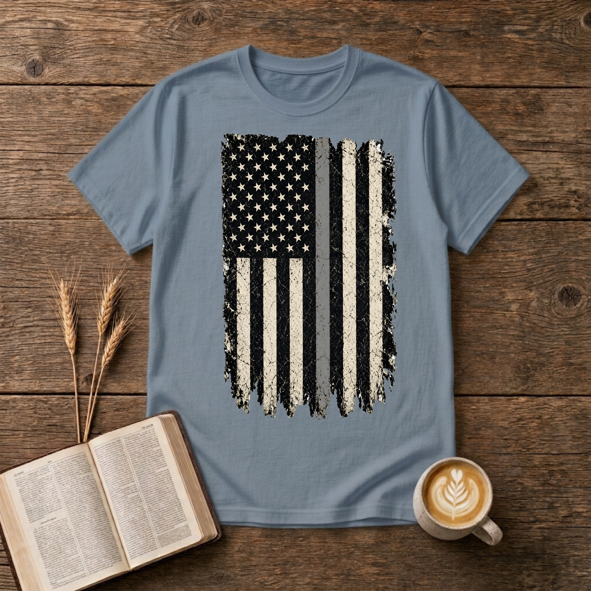 Distressed monochrome American flag with a thin gray line on a Stone Blue unisex T-Shirt