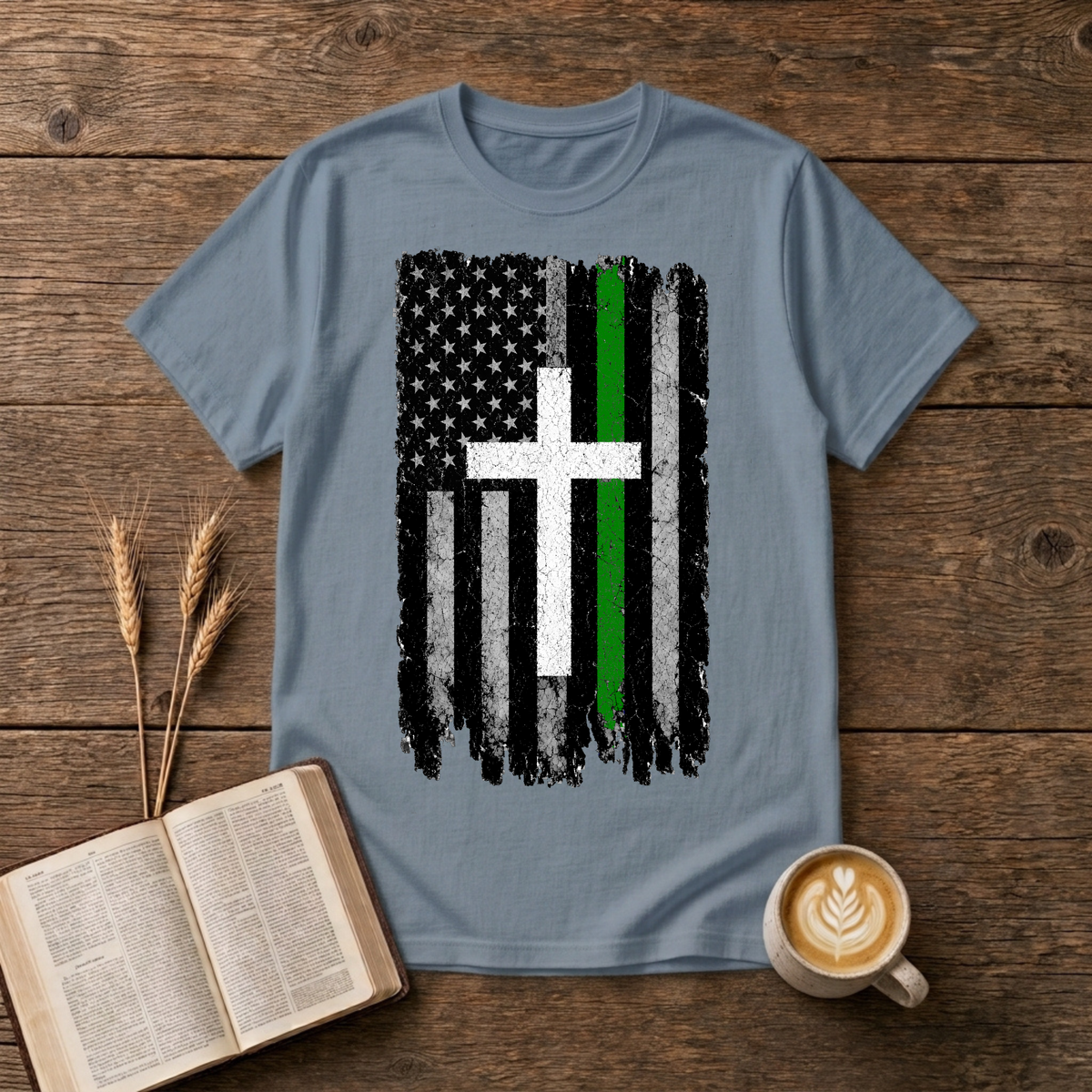 Distressed American flag fused with a cross and green line on a Stone Blue unisex T-Shirt