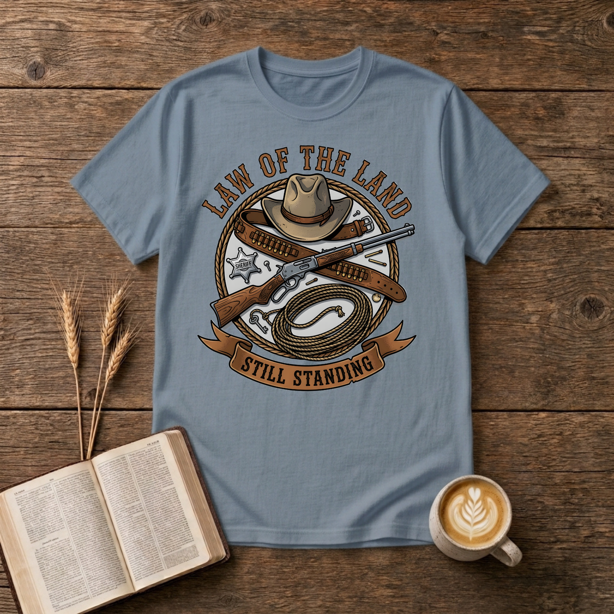 Western lawman emblem with cowboy hat, sheriff star, gun belt, lariat and rifle on a Stone Blue unisex T-Shirt