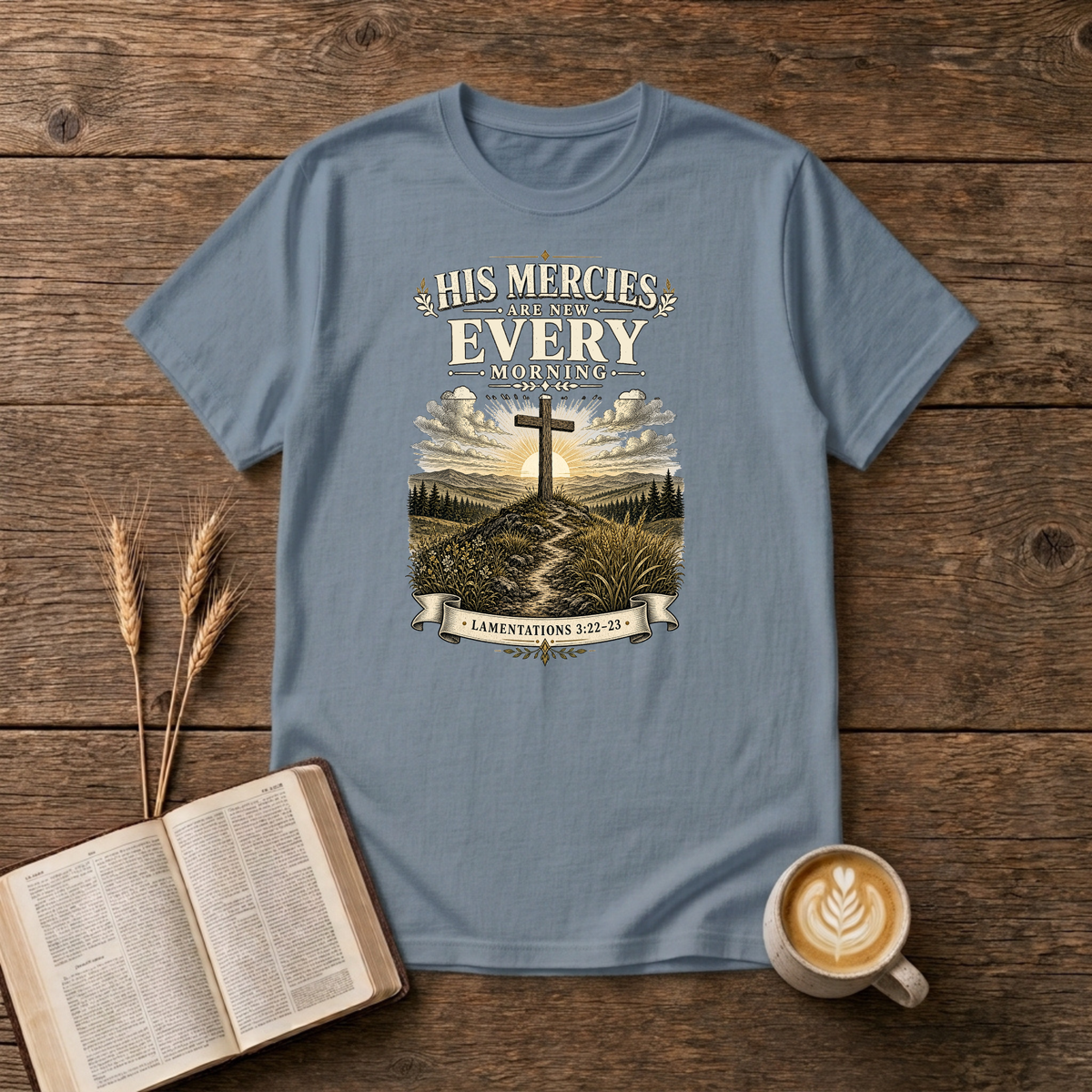 Muted sunrise behind a cross with His mercies are new every morning on a Stone Blue unisex T-Shirt