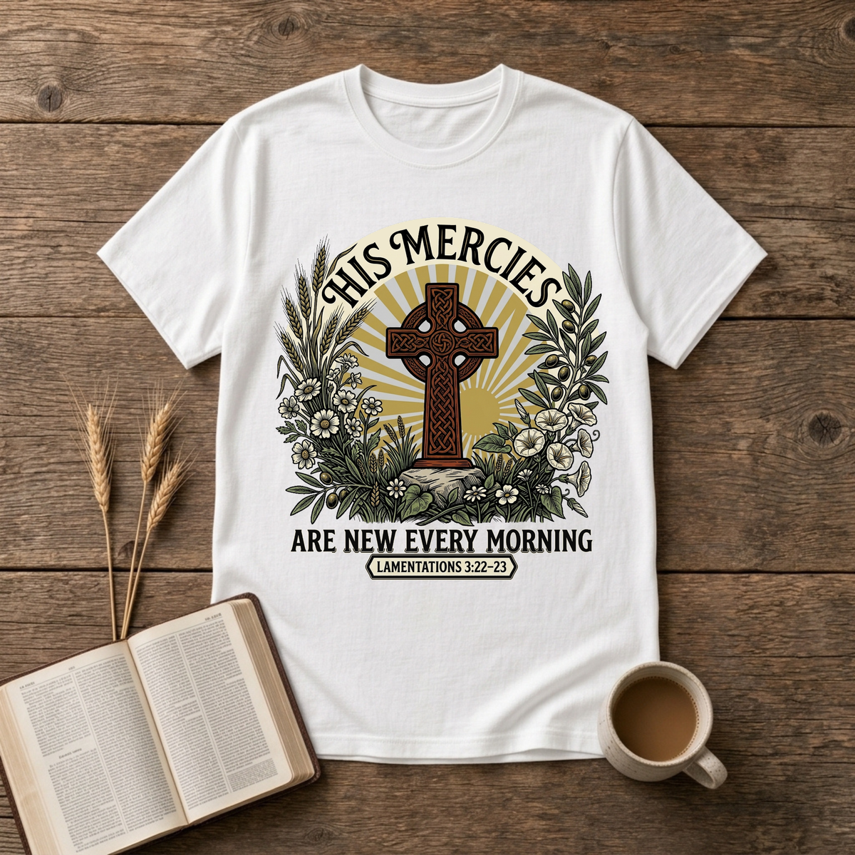 Celtic-style cross framed by florals and warm rays with His mercies are new every morning on a White unisex T-Shirt