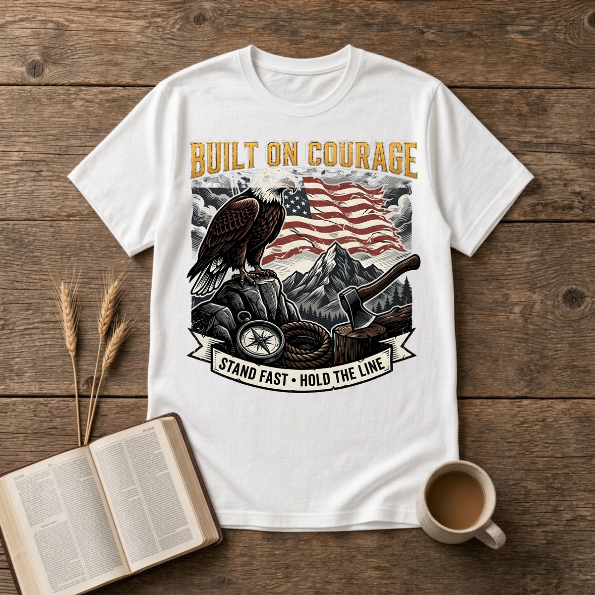 Built on Courage design of a stoic eagle before mountains with a faded American flag on a White unisex T-Shirt
