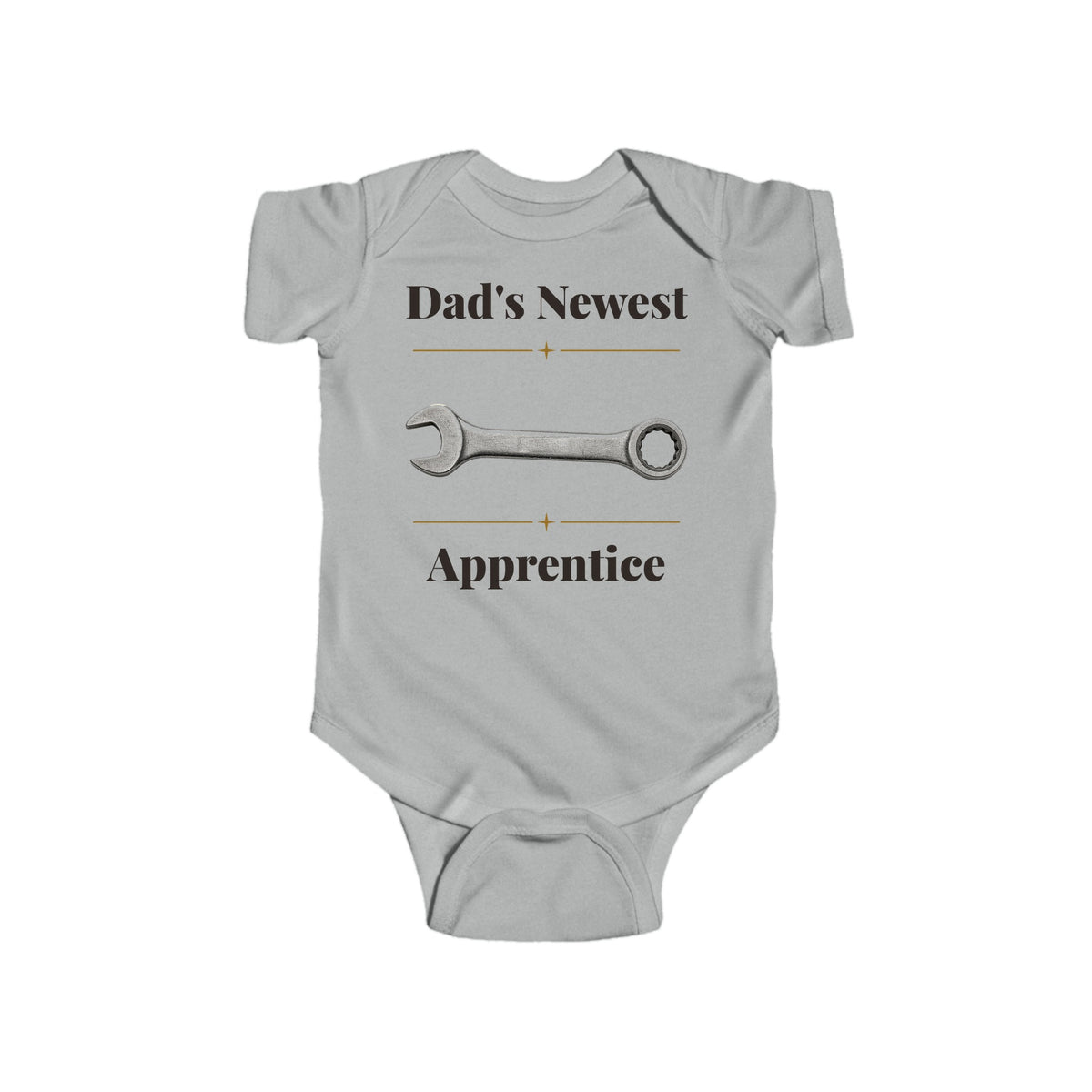 Dad's Newest Apprentice baby bodysuit in Heather on a wood table with a knit blanket, wooden rattle and open Bible