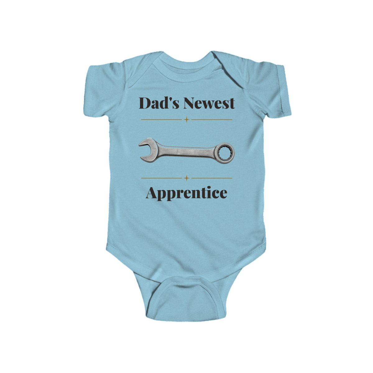 Dad's Newest Apprentice baby bodysuit in Light Blue on a wood table with a knit blanket, wooden rattle and open Bible