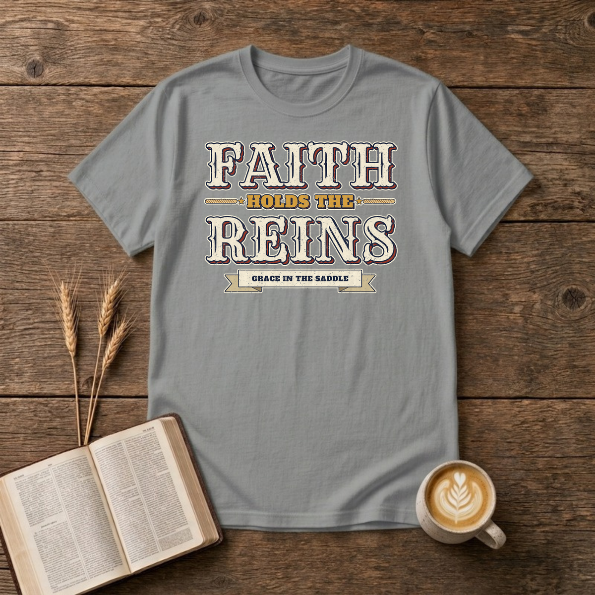 Faith Holds The Reins T-Shirt in Sport Grey, distressed western lettering with a Grace In The Saddle banner, rope lines and stars