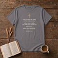 Isaiah 6:8 KJV verse "Also I heard the voice of the Lord, saying, Whom shall I send, and who will go for us? Then said I, Here am I; send me." in cream engraved type under a small gold cross on a Charcoal unisex T-shirt