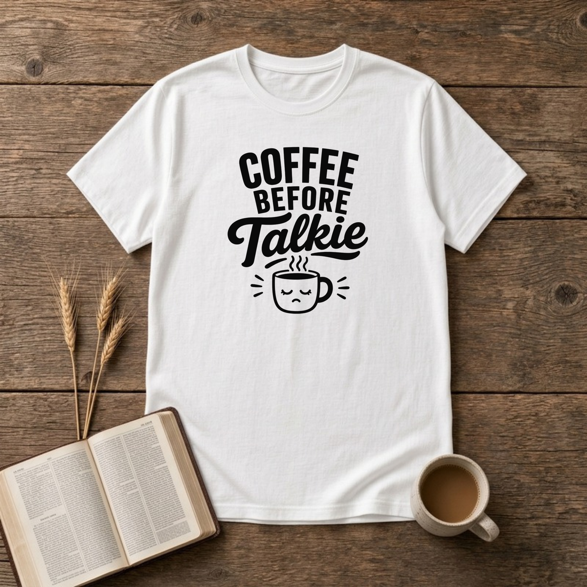 Coffee Before Talkie design with black lettering above a sleepy frowning coffee cup on a White unisex T-Shirt